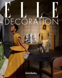 Elle Brasil Decoration cover featuring Mahany Pery in a pleated mustard gown beside Bakary Keita in an architectural interior.