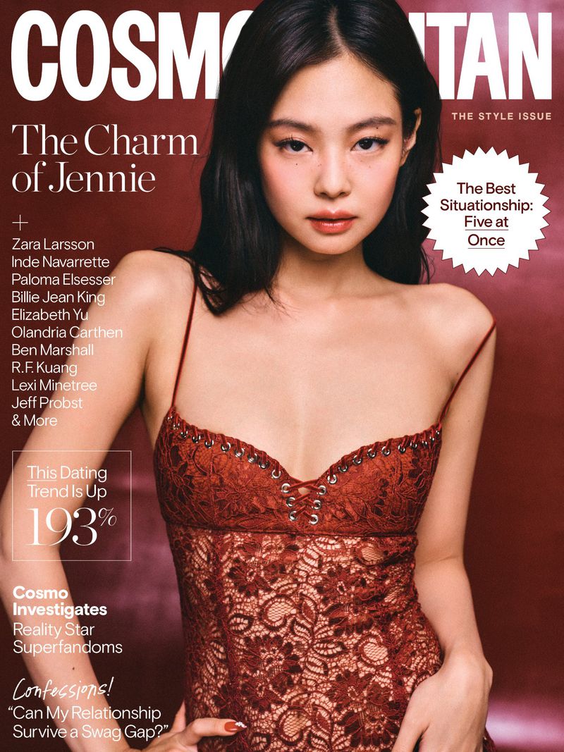 Jennie Kim wearing a dark red lace camisole on the cover of Cosmopolitan magazine against a deep burgundy background.