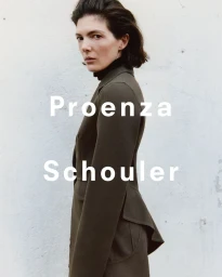 Woman wearing a structured olive green jacket and black turtleneck against a light background with Proenza Schouler text overlay.