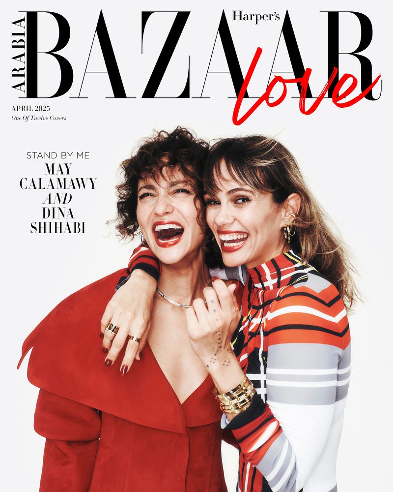 Magazine cover featuring May Calamawy and Dina Shihabi embracing, with Bazaar Arabia logo and the word 'Love' in red script.