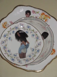 Stacked vintage floral porcelain plates featuring cutout fashion editorial portraits of models against a plain cream surface.