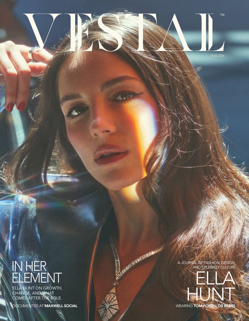 Close-up portrait of Ella Hunt on the cover of Vestal Magazine with a rainbow prism light effect across her face and wearing a diamond necklace.