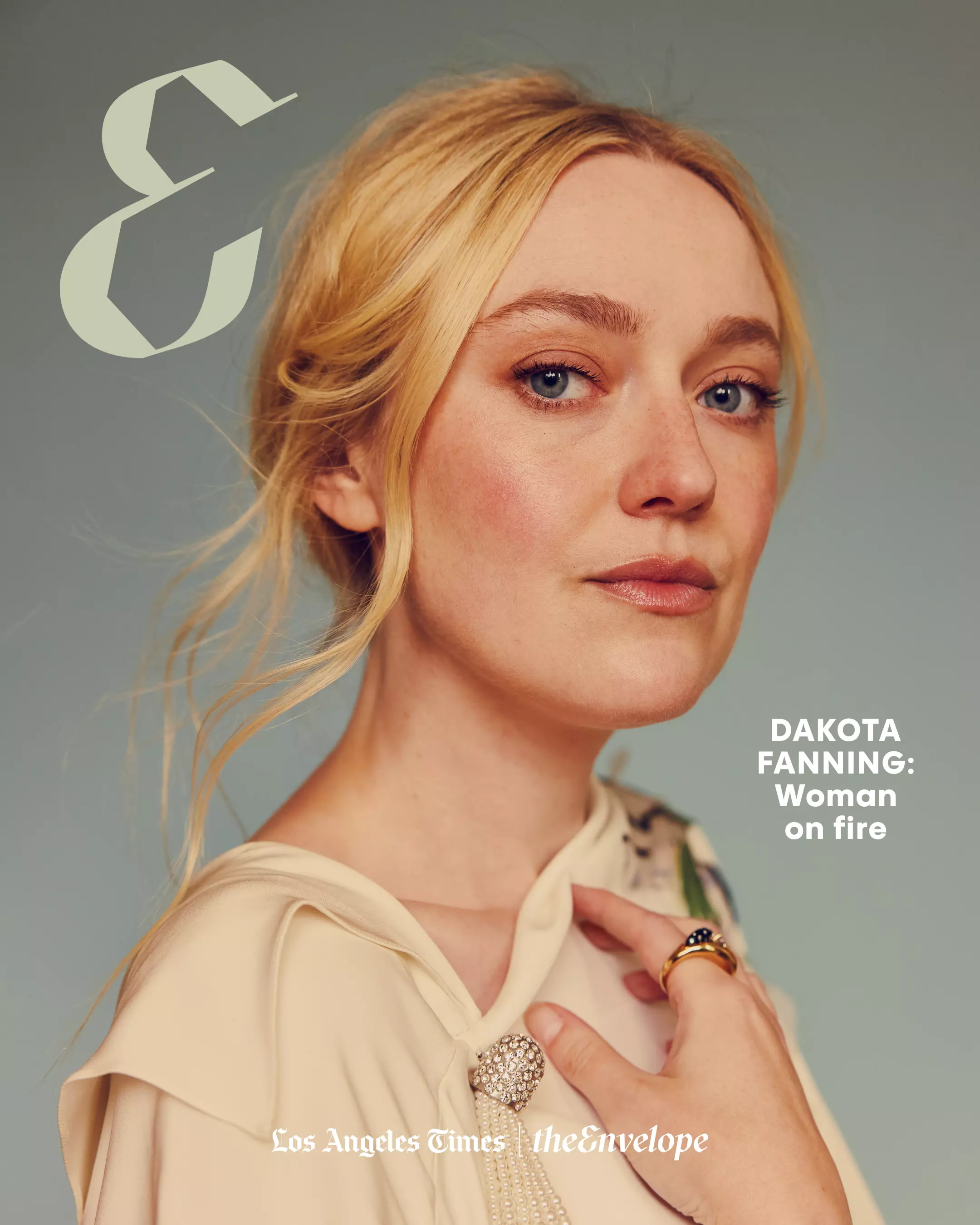 Portrait of actor Dakota Fanning wearing a cream blouse and gold ring for the Los Angeles Times The Envelope cover.