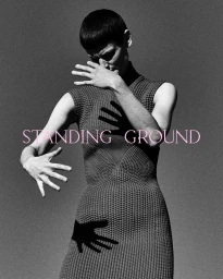 Model Saskia de Brauw posing in a textured sleeveless dress with hand shadows across her torso in a Standing Ground campaign.