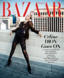 Céline Dion leaning against a rooftop ledge overlooking city buildings for the Harper's Bazaar magazine cover.