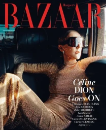 Céline Dion in a sparkling gold dress and dark visor sunglasses seated in the backseat of a car on a magazine cover.