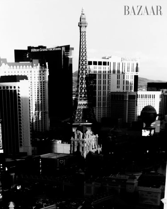 Black and white cityscape of the Las Vegas Strip featuring the Paris replica Eiffel Tower surrounded by modern resort towers.