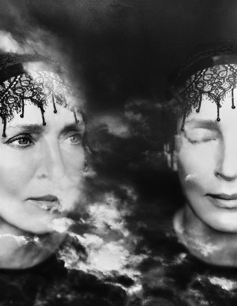 Dreamlike image with two women's faces overlaid on a cloudscape. One woman is looking to the left, while the other has her eyes closed.