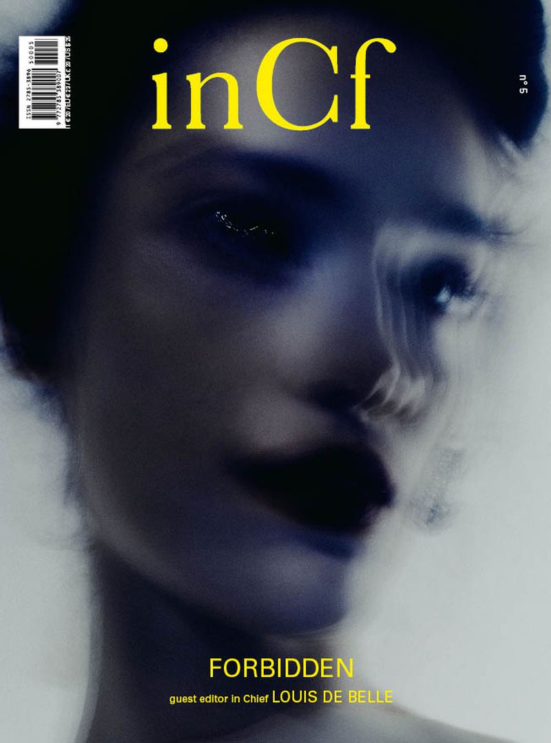 Magazine cover featuring a portrait of an adult female with diffused lighting, bold lipstick, and the title 'inCf' in yellow text.