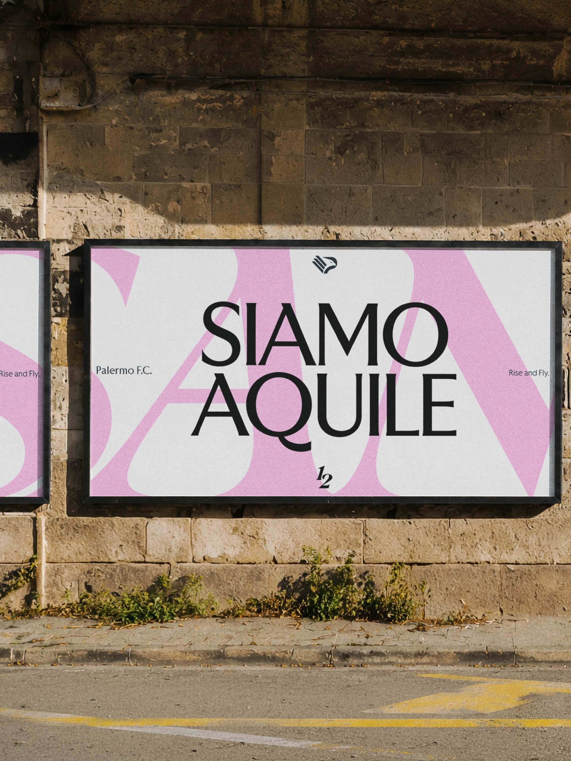 Outdoor billboard poster on a stone wall displaying pink and white typography reading Siamo Aquile for Palermo FC.