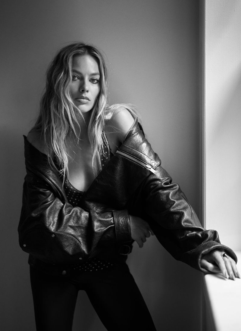 Margot Robbie wearing a black leather jacket in a portrait photographed by Mario Sorrenti for Vogue Australia