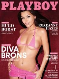 Magazine cover featuring a woman wearing a pink bikini and matching miniskirt against a dark red backdrop.