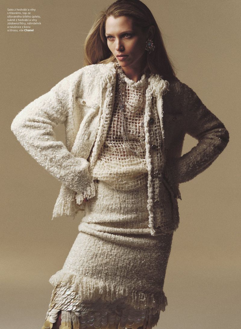 Hana Jirickova posing in a textured cream tweed jacket and matching fringe skirt for Harper's Bazaar Czech Republic.