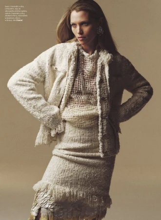 Hana Jirickova posing in a textured cream tweed jacket and matching fringe skirt for Harper's Bazaar Czech Republic.