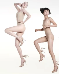 Two female models wearing nude bodysuits and high-heeled pumps against a plain white background for Christian Louboutin.