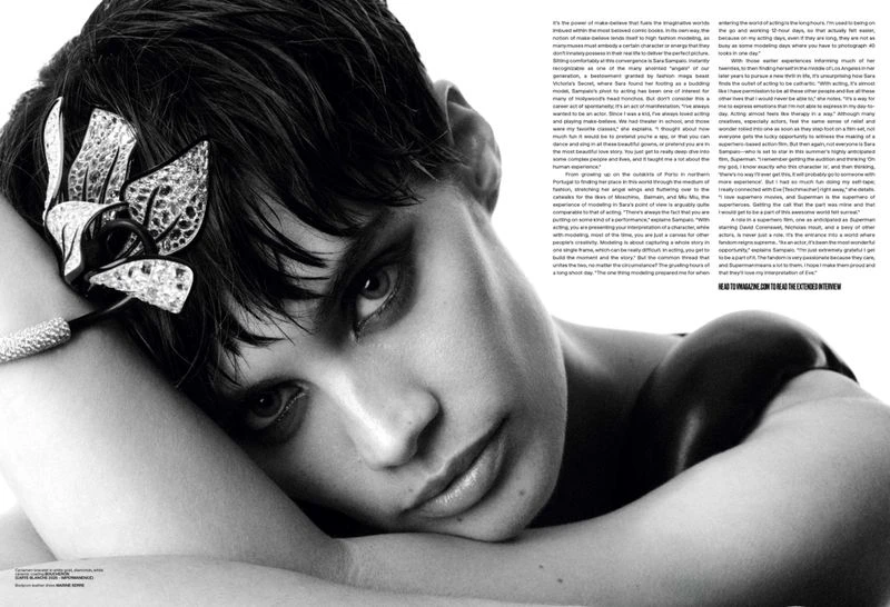 Close-up portrait of model Sara Sampaio resting head on arms, wearing jewelled hairpiece