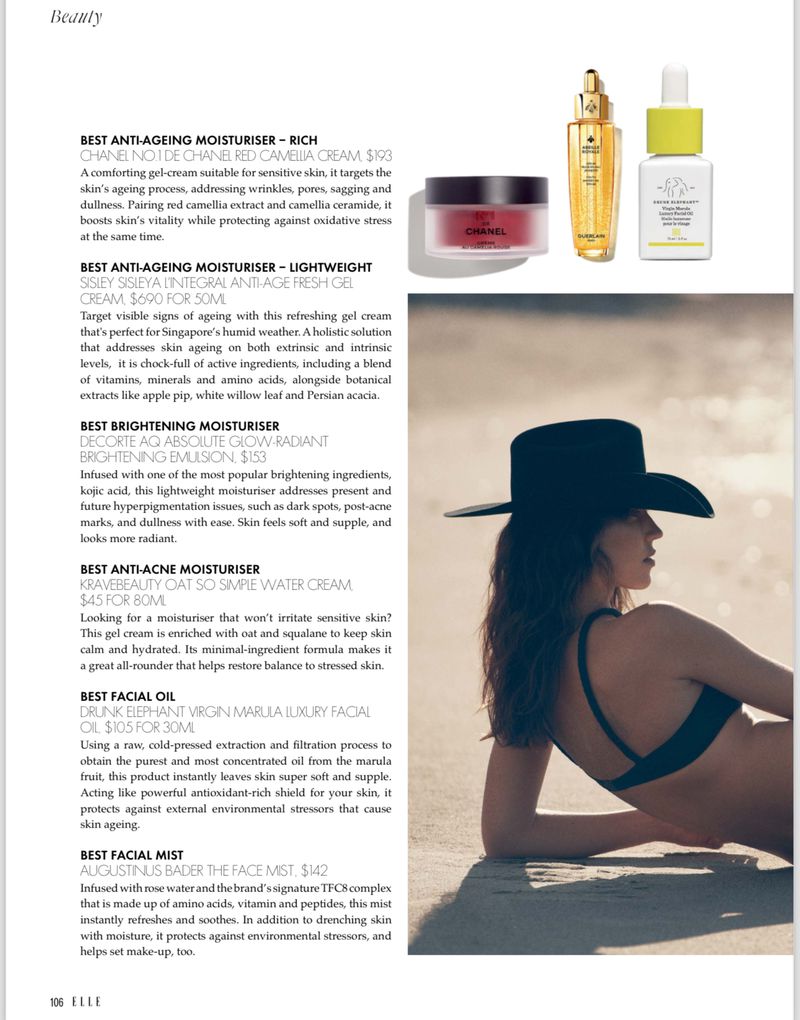Magazine beauty spread featuring a woman in swimwear on a beach, alongside skincare products and text highlighting moisturizers.