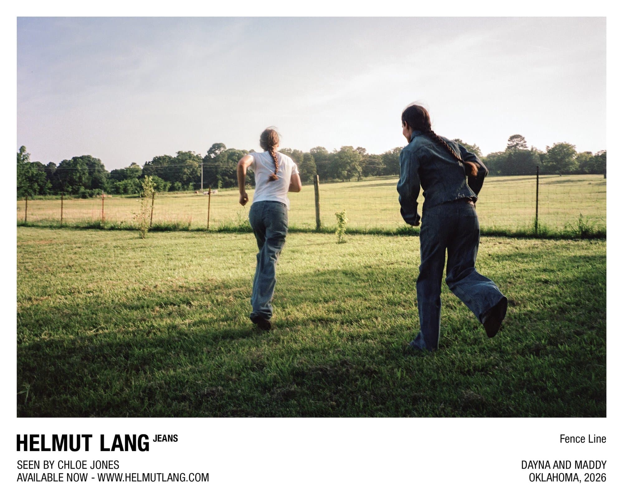 Two women running across a grassy field towards a fence line wearing denim jeans in an ad for Helmut Lang Jeans.
