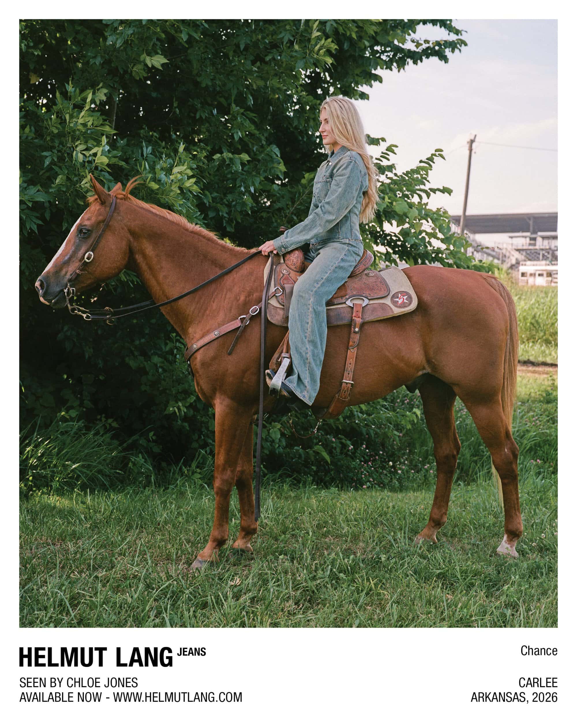 A blonde woman wearing a full denim outfit sits atop a chestnut horse in a grassy field for Helmut Lang Jeans.