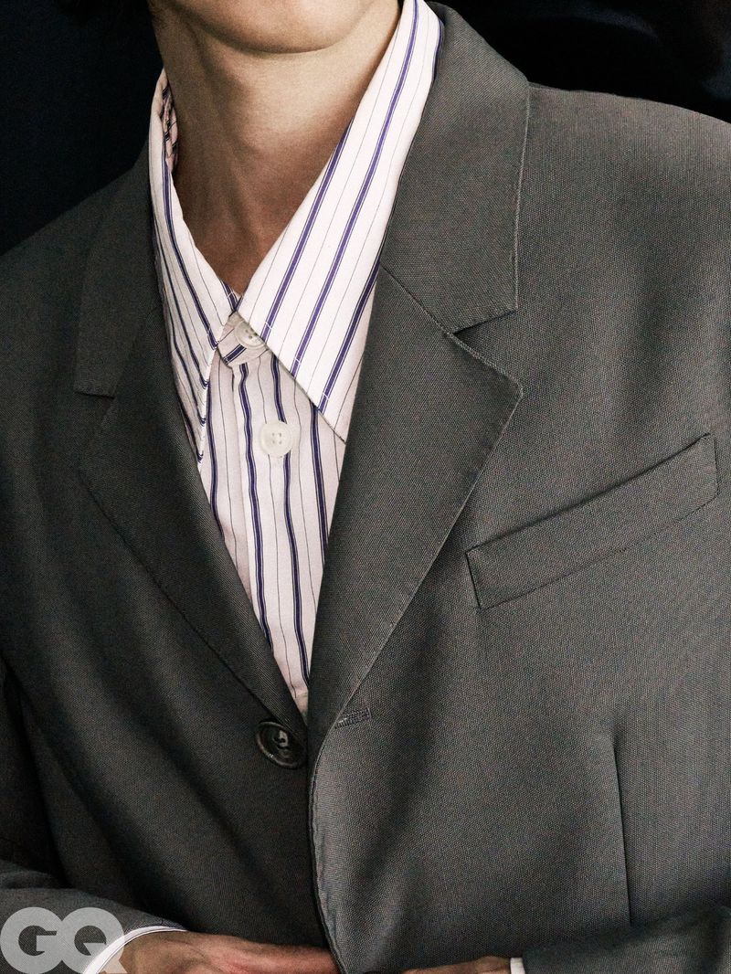 Model Meng Yu Qi wearing a grey tailored blazer and vertical-striped collared shirt for GQ China.