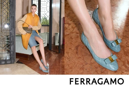 Vittoria Ceretti seated in a coat and quilted blue flats holding a handbag for Salvatore Ferragamo Fall-Winter 2026 campaign.