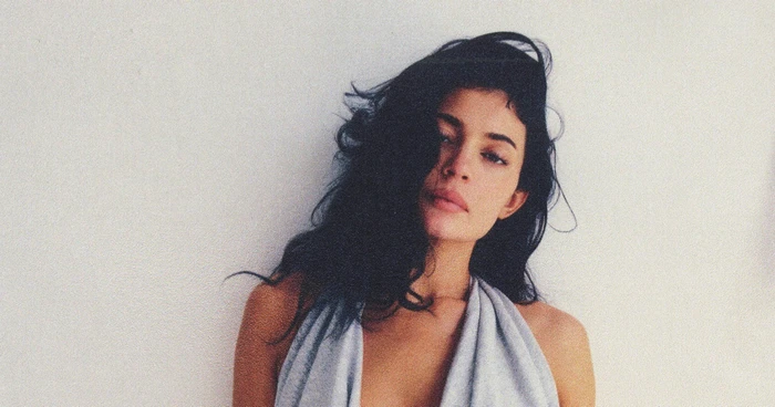 Kylie Jenner wearing a grey halter top against a plain white background for the Dear Summer, Love KHY campaign by Khy