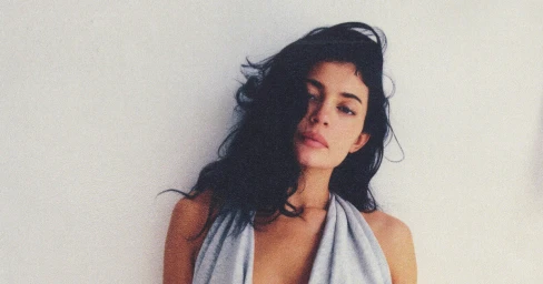 Kylie Jenner wearing a grey halter top against a plain white background for the Dear Summer, Love KHY campaign by Khy