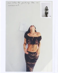 Kylie Jenner wearing a leopard print two-piece set against a plain background for Khy Dear Summer collection.