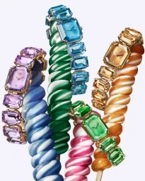 Colorful crystal watches wrapped around candy-like swirl sticks for the Swarovski Summertime campaign.