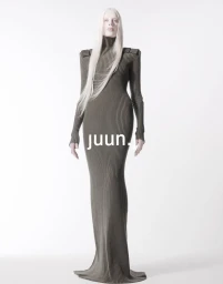Model with long white hair wearing a fitted ribbed olive green turtleneck dress on a white background