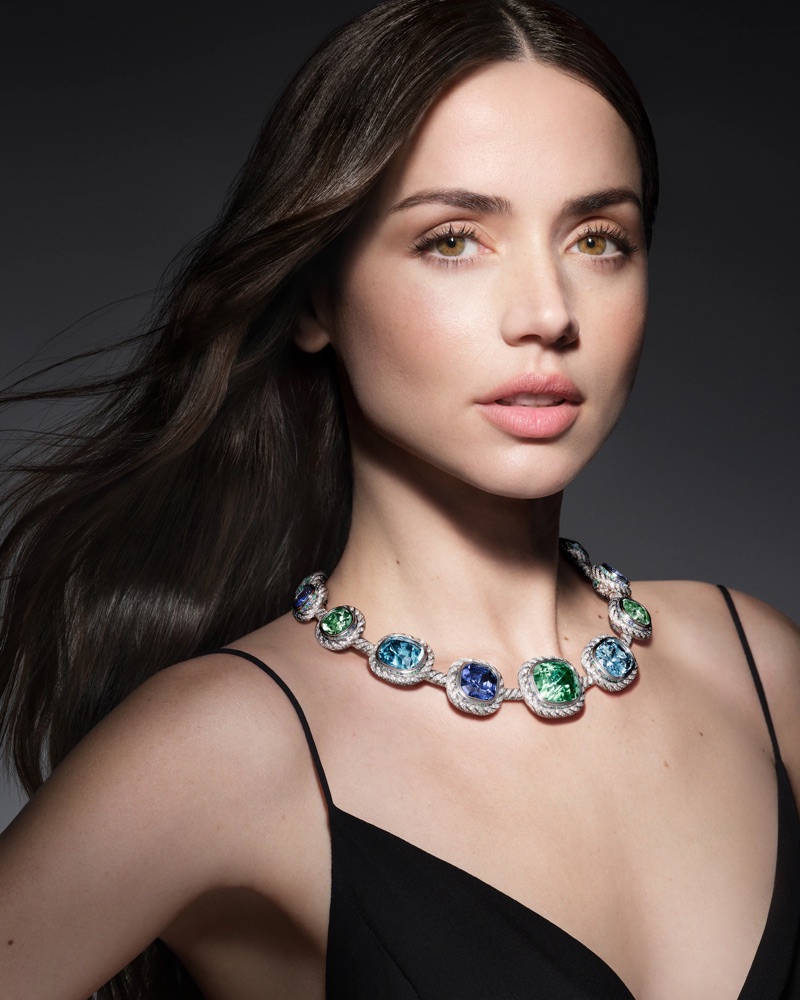Ana de Armas wearing a diamond and gemstone necklace with blue and green stones for Louis Vuitton Mythica