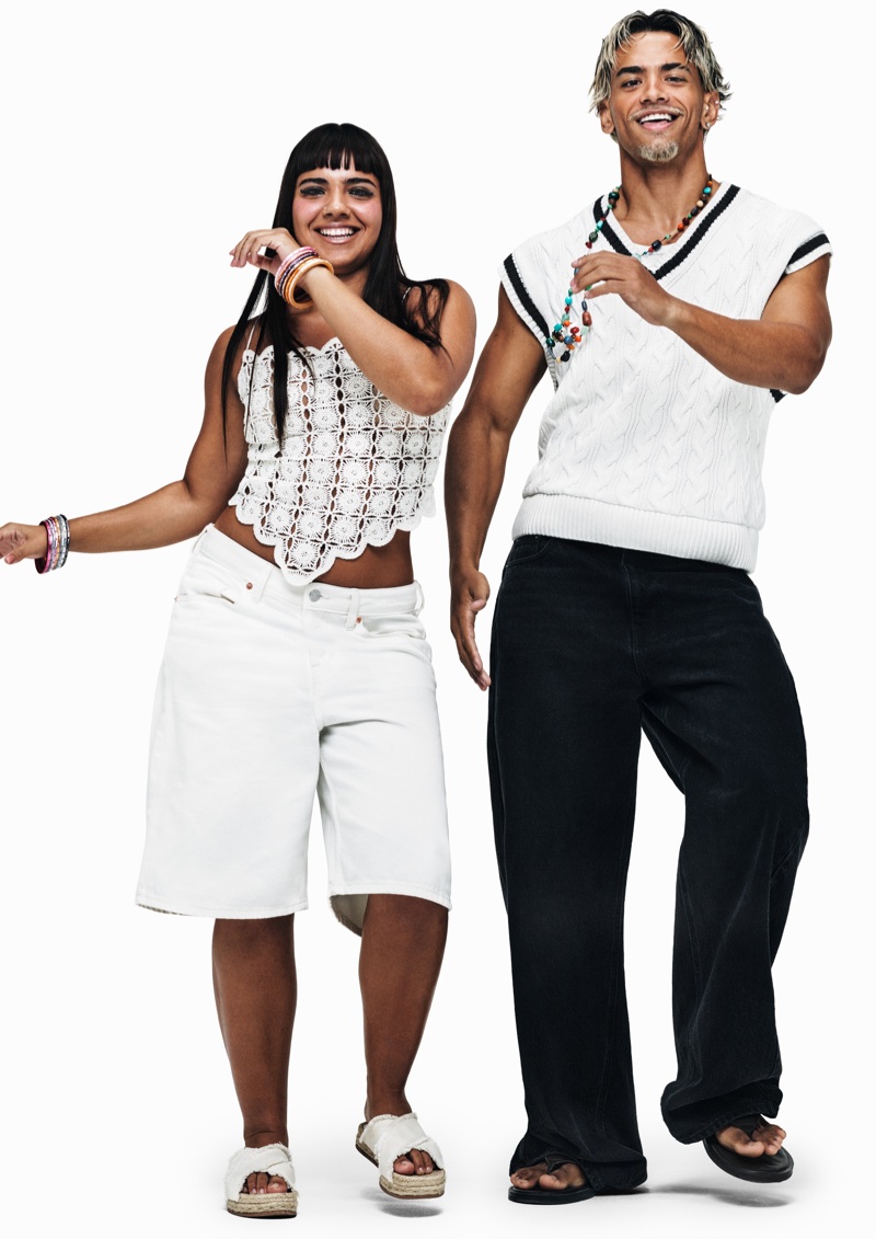 Two models posing against a white seamless background for the H&M and RIO project, photographed by Rafael Pavarotti.