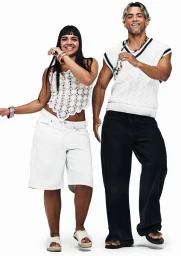 Two models posing against a white seamless background for the H&M and RIO project, photographed by Rafael Pavarotti.