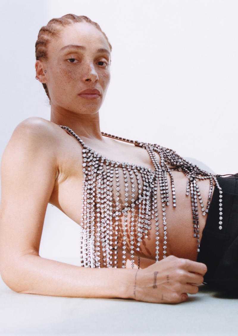 Adwoa Aboah wearing a sparkling crystal fringe top against a clean white background