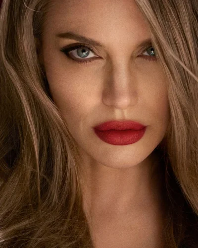 Close-up portrait of Angelina Jolie with bold matte red lips and winged eyeliner for Tom Ford Runway Lip Stylo Matte.