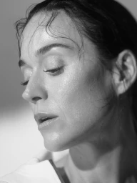 Close-up portrait of a woman with wet damp hair and glistening skin in black and white for Balenciaga On Repeat