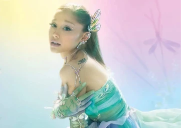 Ariana Grande wearing crystal dragonfly jewelry and pastel dress for Swarovski campaign