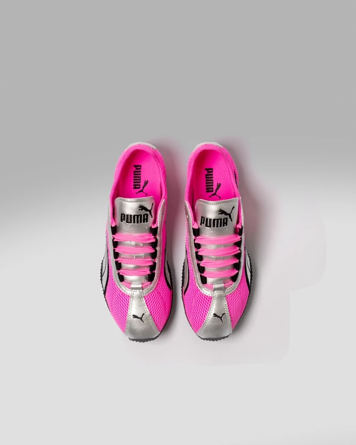 Top-down view of Puma H-Street sneakers featuring hot pink mesh, silver metallic panels, and black branding against a light background.