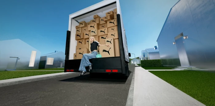 ROSÉ seated in the back of a delivery truck filled with Puma branded boxes for the H-Street campaign.