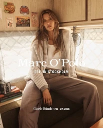 Gisele Bundchen wearing a cream knit cardigan and brown trousers inside a camper van for Marc OPolo Spring 2026 campaign