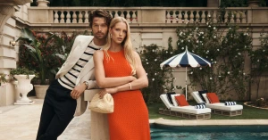 Patrick Schwarzenegger and Abby Champion pose by a pool for the Tommy Hilfiger Spring 2026 campaign photographed by Lachlan Bailey.