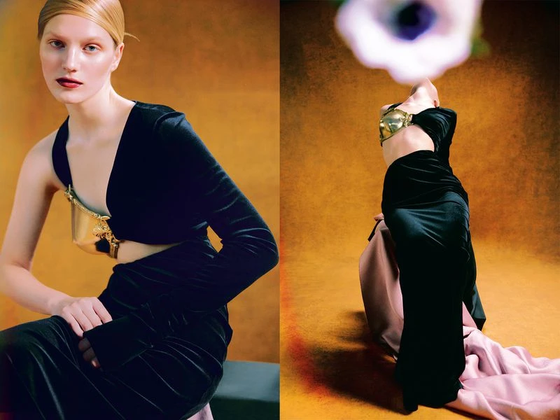 Fashion shot of a woman in black dress and gold accessory with floral element. Model poses in two different angles and background.