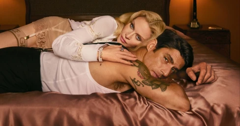 Madonna and Alberto Guerra lying together on a satin bed for Dolce & Gabbana campaign shot by Mert Alas