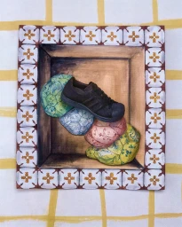 Dark brown sneaker resting on colorful patterned pads inside a wooden box frame on a yellow and white grid background