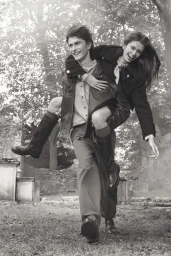 Young man carrying a smiling young woman on his back outdoors in a park setting for Zara campaign photography.