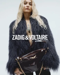 Paris Jackson in a dark fuzzy coat holding a patent leather shoulder bag for Zadig & Voltaire Fall-Winter 2025 Campaign
