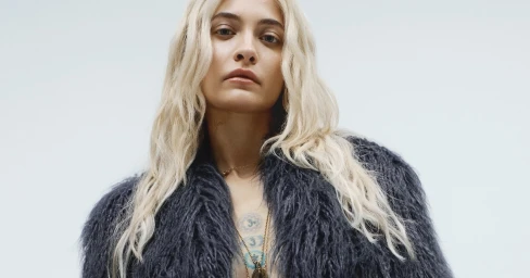 Paris Jackson wearing a dark textured faux fur jacket against a plain white background for Zadig & Voltaire