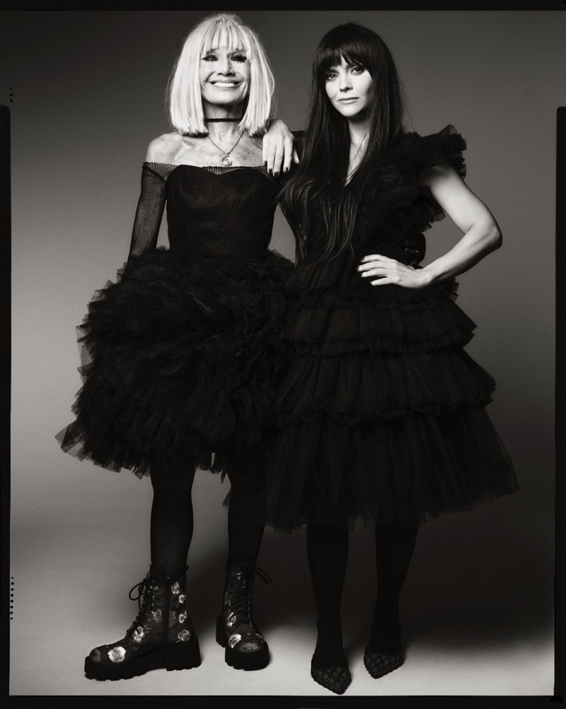 Betsey Johnson and Christina Ricci wearing black tulle dresses against a grey studio backdrop for Fall 2025 campaign.