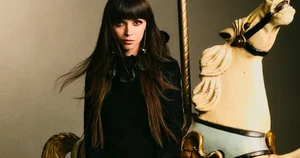 Christina Ricci sitting on a vintage carousel horse for the Betsey Johnson Fall 2025 campaign photographed by Zoey Grossman