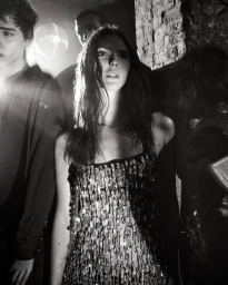 Black and white portrait of Mona Tougaard and Vittoria Ceretti wearing embellished Dolce & Gabbana attire.